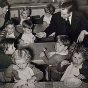 Holt with a group of children after he introduced the Child Endowment legislation and was pronounced the 'Godfather of a million children'