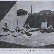 Posture chairs and sandbags help the physical development of handicapped babies - a scene in one of the sunny courtyards featured in the design of Brush Farm Infants Home [original caption]
