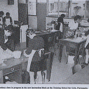 A cookery class in progress in the new instruction block at the Training School for Girls, Parramatta