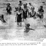 There are kiddies from back of Bourke among this happy group of youngsters in the water at Ramsgate, where they are the guests of the Junior Red Cross