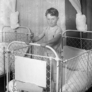 Little boy in cot