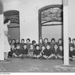 136398 [children sitting in shelter during air raid precaution practice]